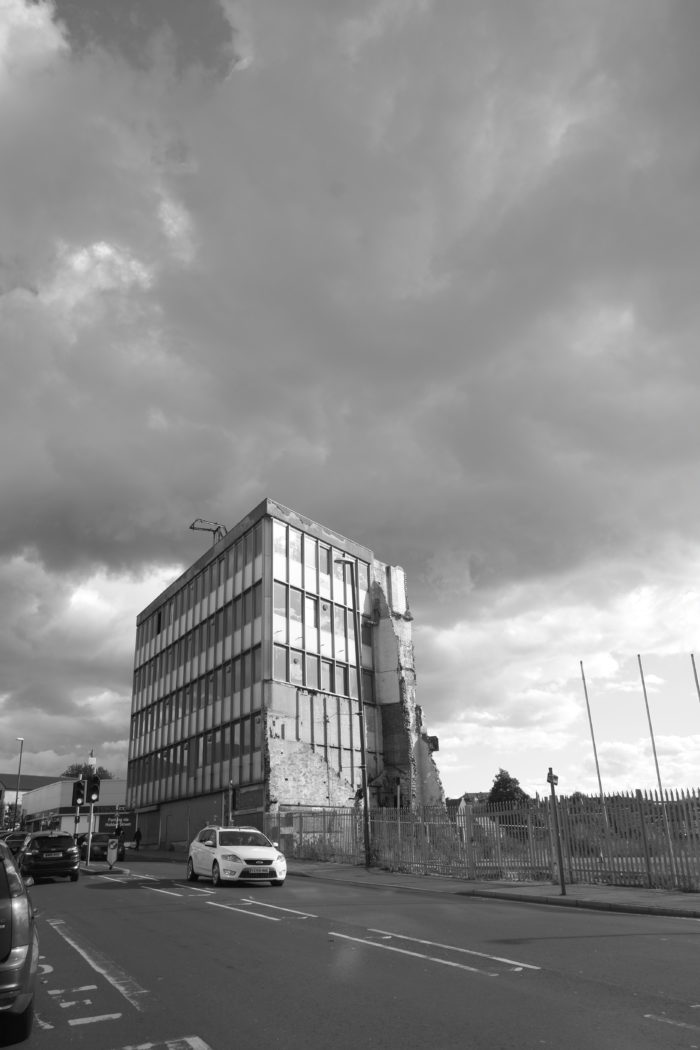 tower block against rain clouds