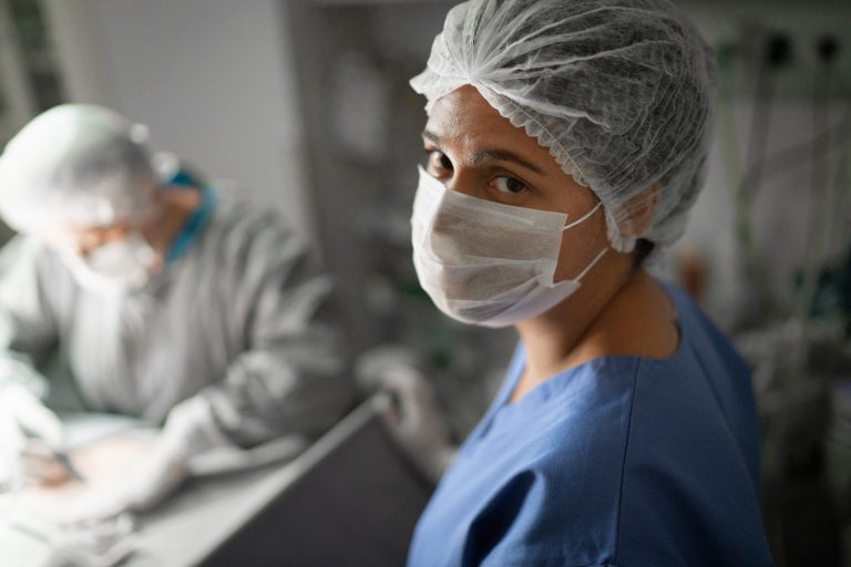 Image of a masked nurse in a hospital operating room (credit: Royal College of Nursing)