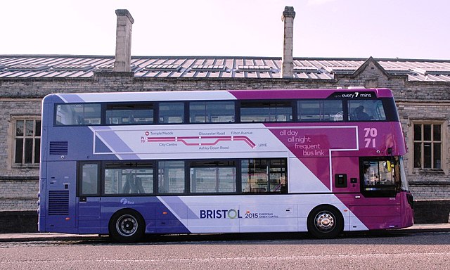 A pink and purple First Bristol bus, parked