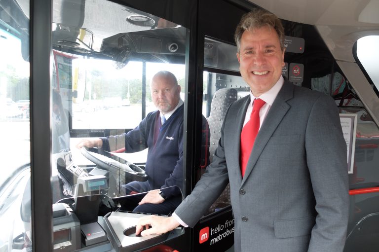 West of England Metro Mayor Dan Norris poses with a bus driver in his cab