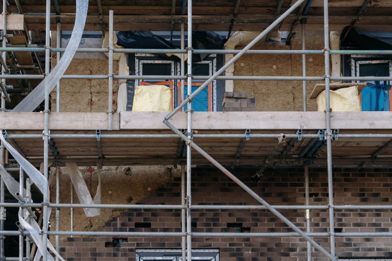 Image of modular homes at Bonnington, Lockleaze showing bricks being removed (credit: David Griffiths)