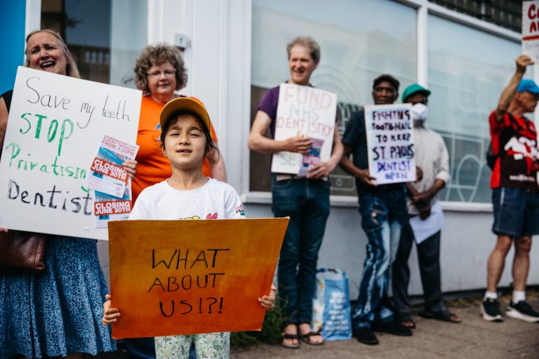 Image of people protesting against the closure of dental care services in St Pauls, Bristol in June 2023 (credit: Alexander Turner)