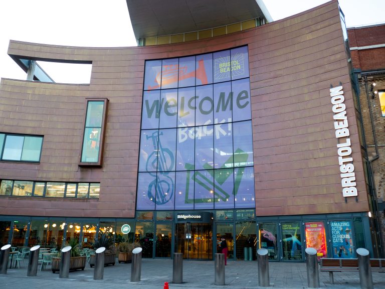 Exterior of Bristol Beacon, a building with a large glass front.