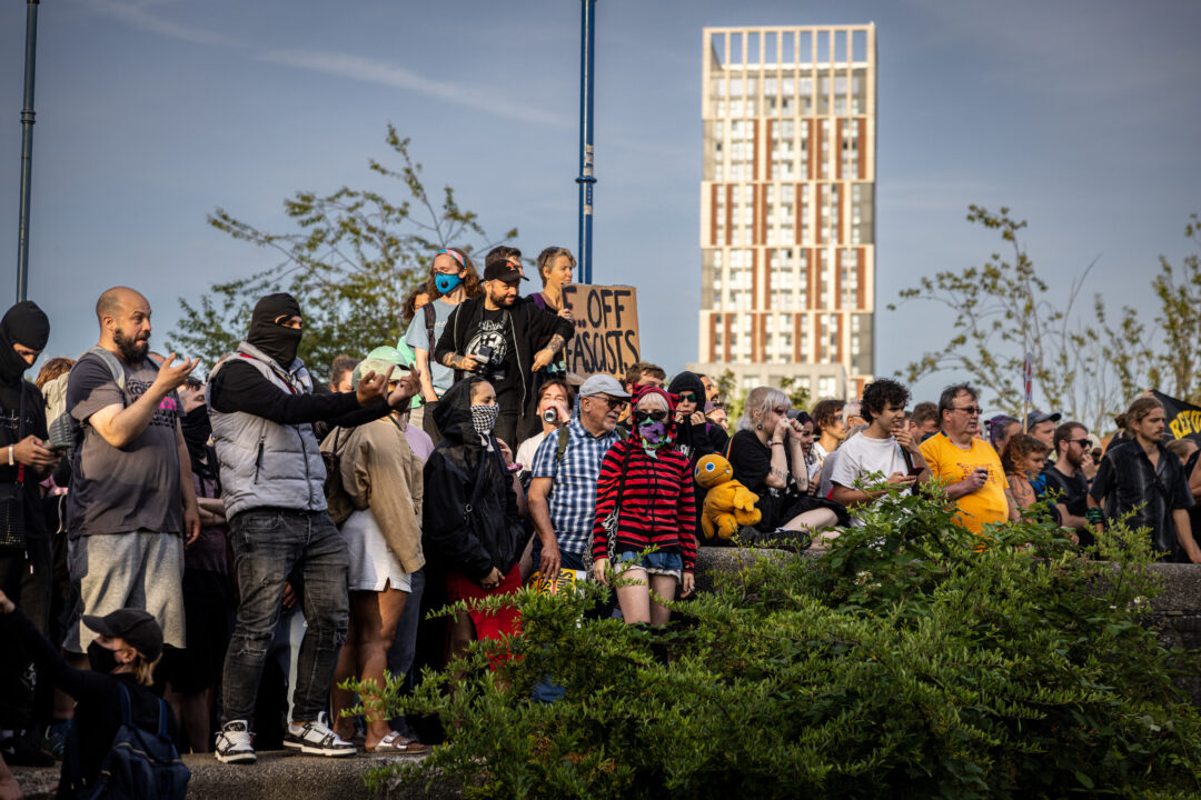 A group of counter protesters look on from Castle Park