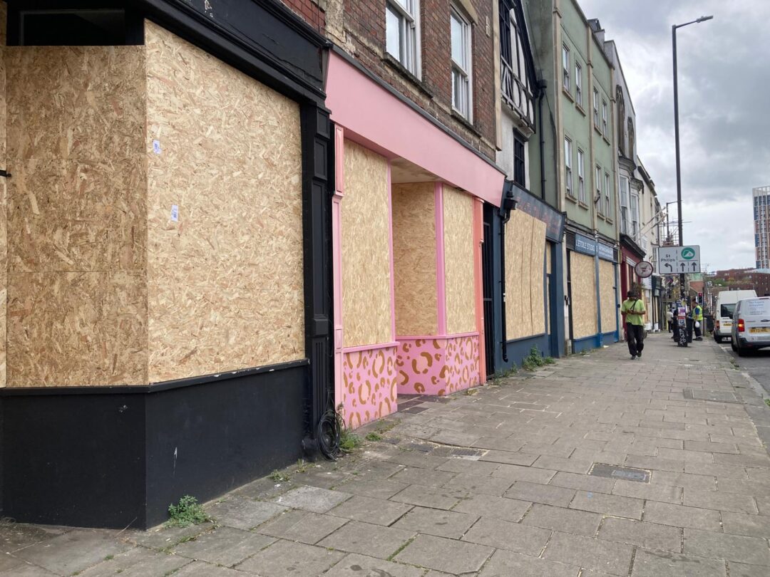 Shops of Old Market are boarded up with wooden panels