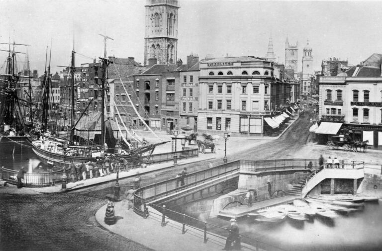 19th century photograph of Bristol Harbour, with large boats on the River Frome in the foreground.