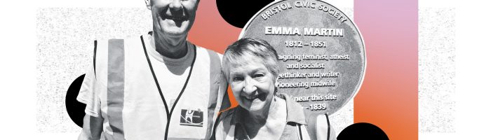 A smiling man and woman wearing high-viz vests